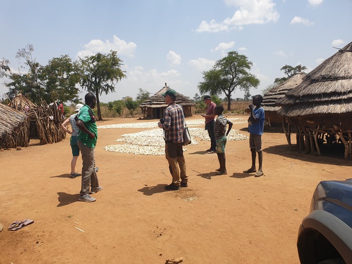 Researchers visiting a homestead in the Ugandan countryside
