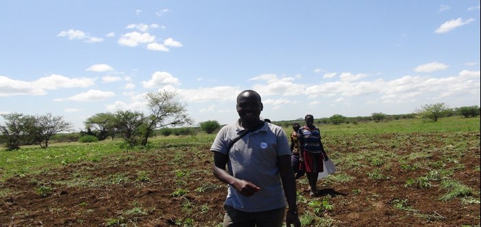 A man in the field in Uganda