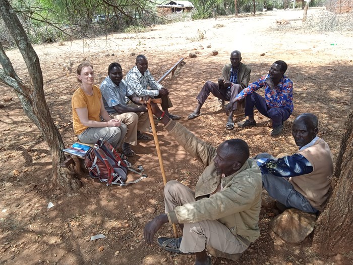 People sitting in a circle talking