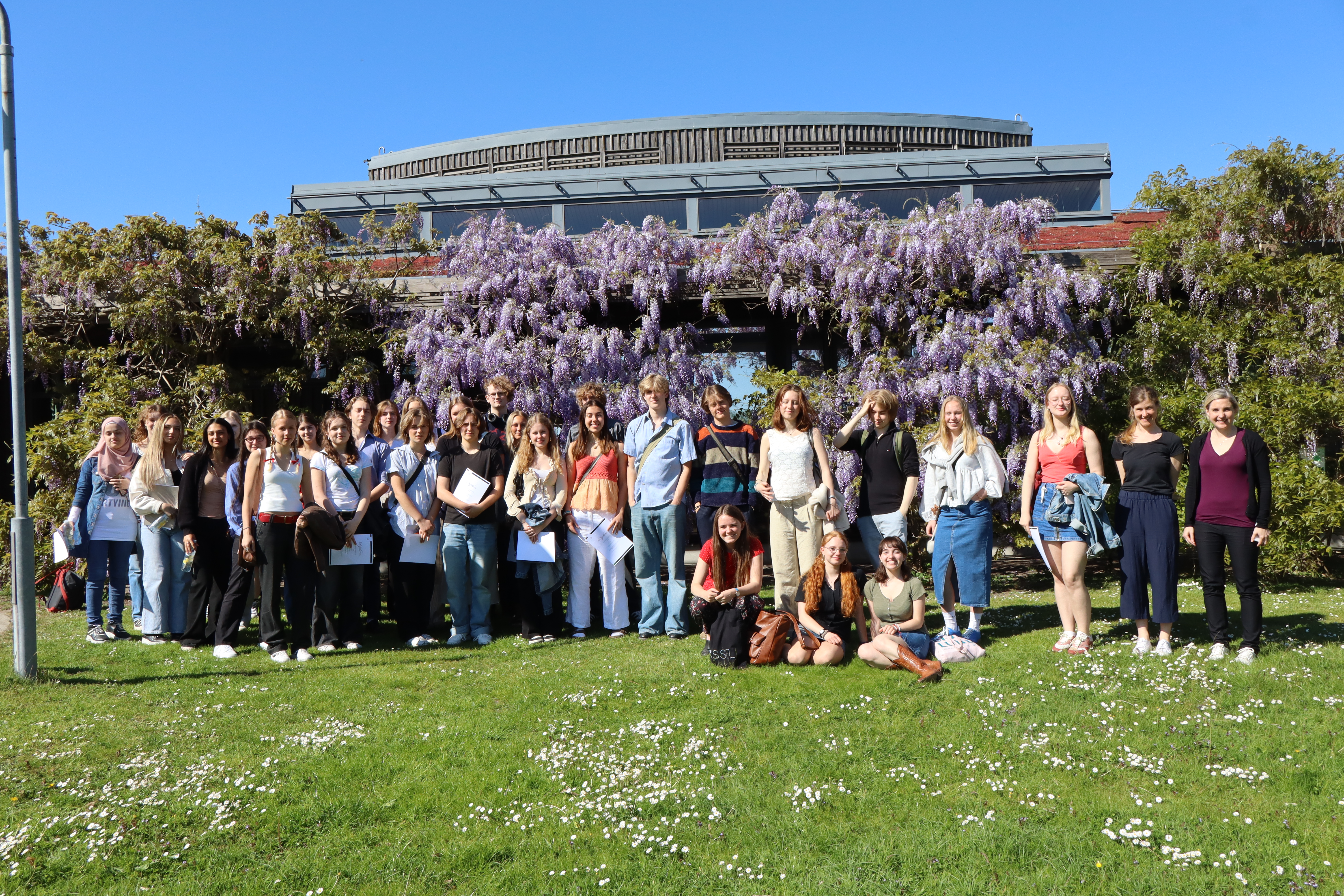 A group of students posing for photo outdoors