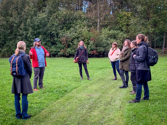 People standing on a lawn. Photo.