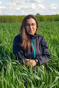 A woman sitting in a field. Photo.