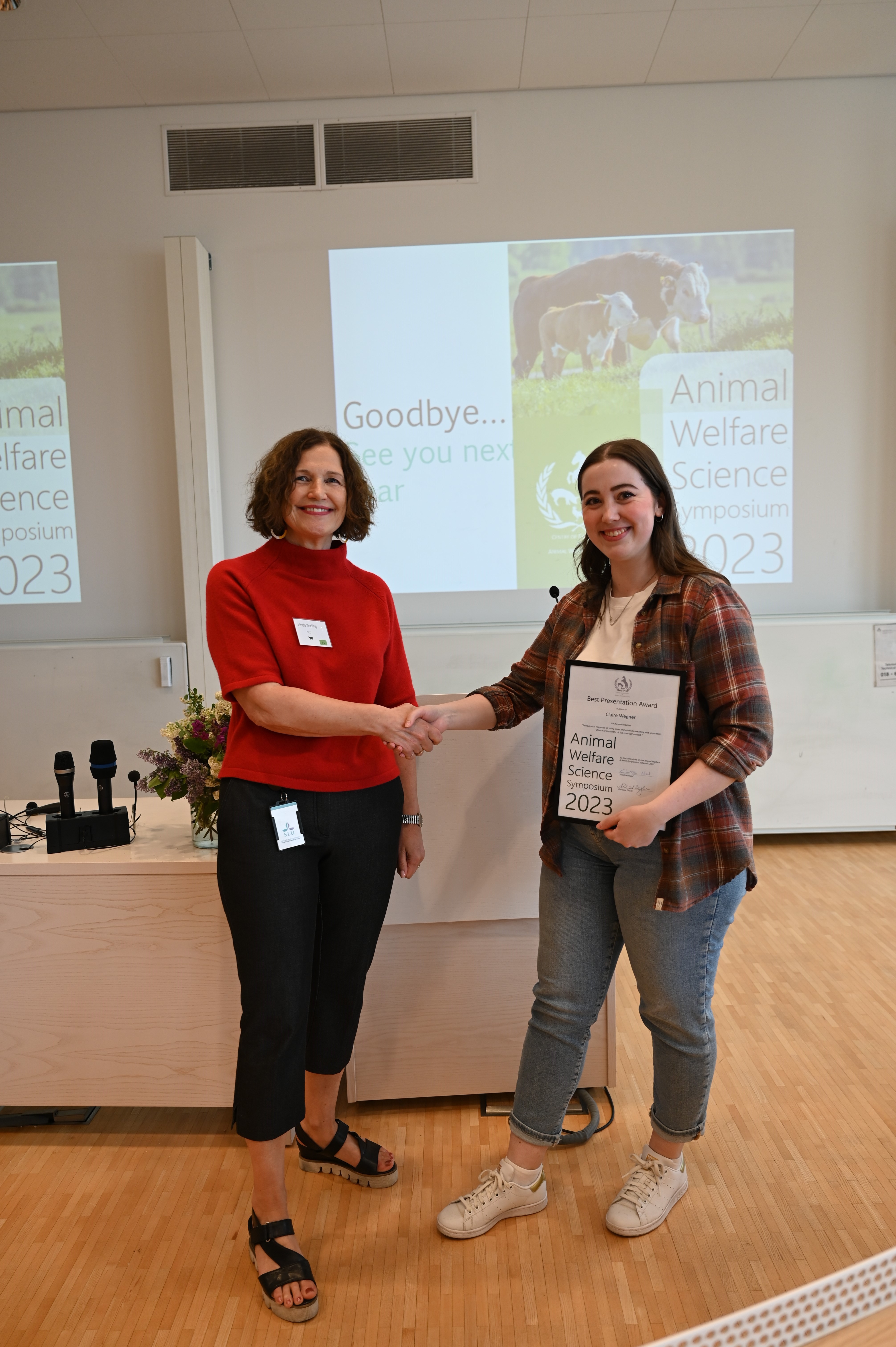 Linda Keeling congratulates Claire Wegner for the best presentation of the year