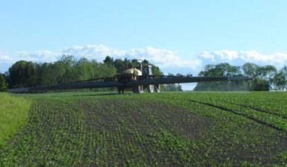 A field is sprayed with pesticides, photo.