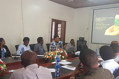People sitting around a table during a workshop in Addis Ababa. 