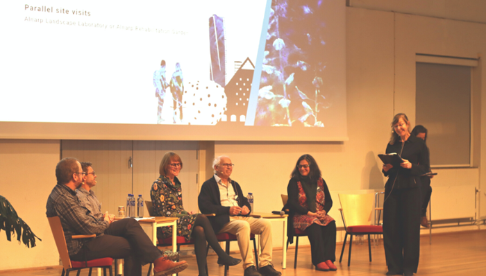 People on stage at a conference.
