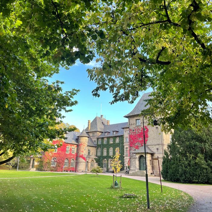 A castle surrounded by autumn colours.