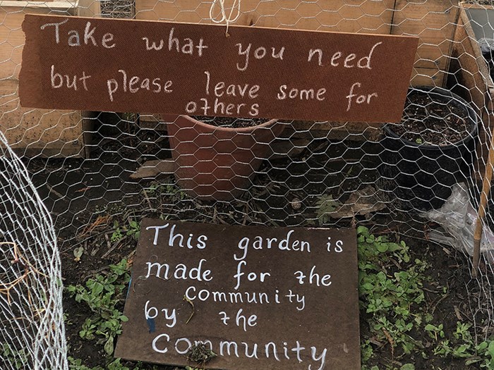 A sign reading Take what you need but leave some for others.