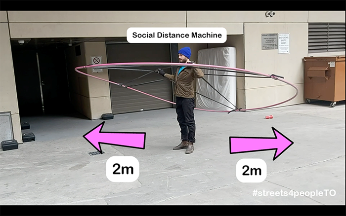 Social Distance Machine, a giant wearable hoop made out of plastic conduit piping and bicycle inner tubs to clearly demonstrate how large 2m really is.