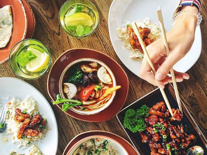 A table full of plates of food. Photo.