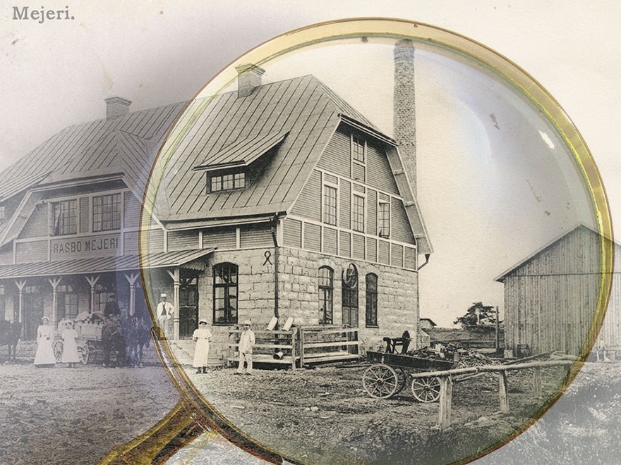 Ett förstoringsglas över ett gammalt svart-vitt foto.