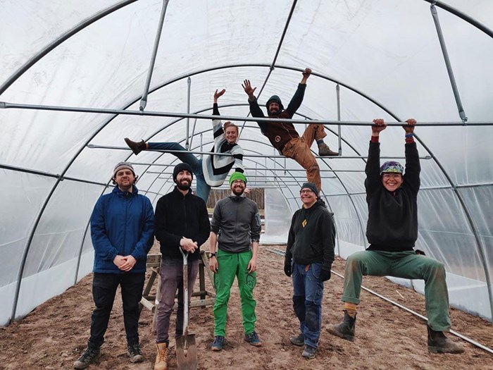 Happy people in a green house, photo.