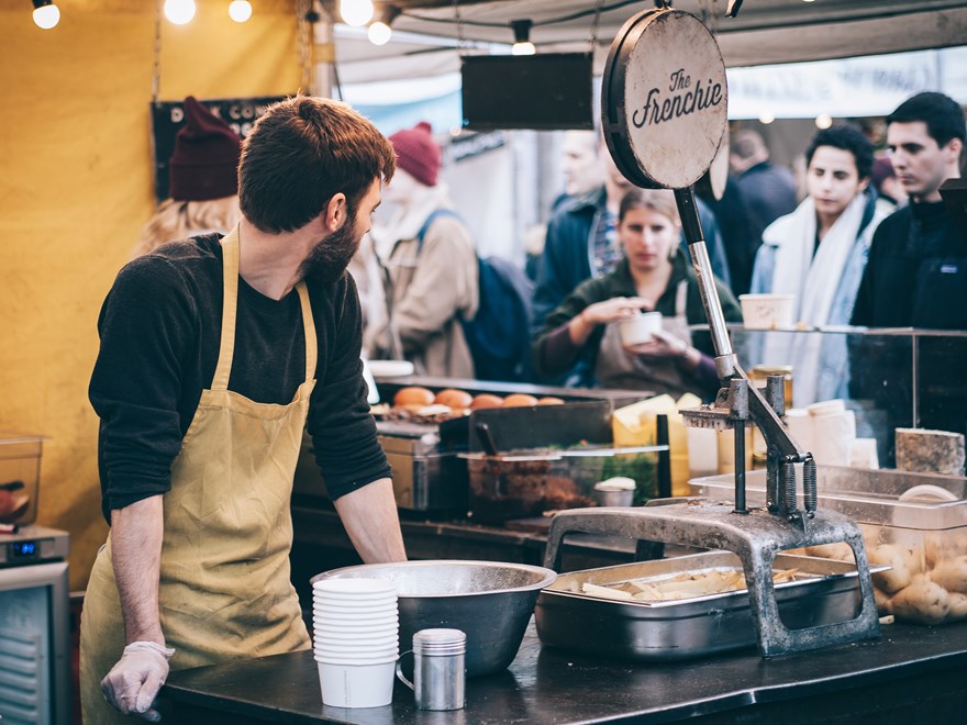 people queing up to buy street food