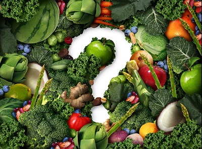 Question mark surrounded by vegetables. Photo.