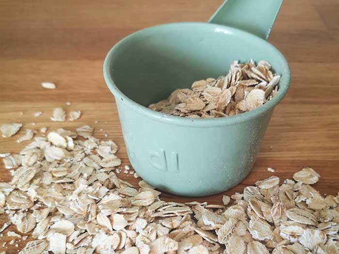 flakes of oats with green jar