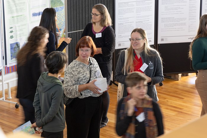 Poster presentation during symposium. Photo. 