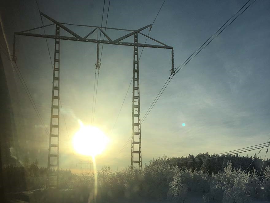 Kraftledning i solnedgång fotografi