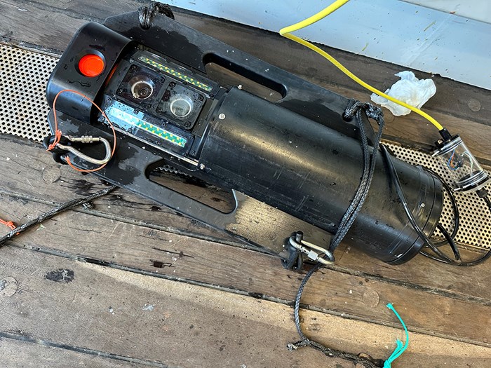 Black tube with two camera lenses