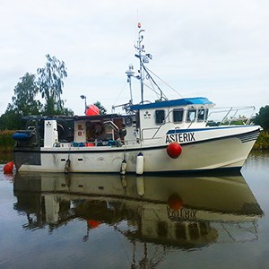 The research vessel Asterix on a canal. Photo.