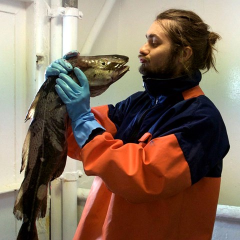 Man kissing a cod