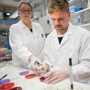 Student being tutored in lab