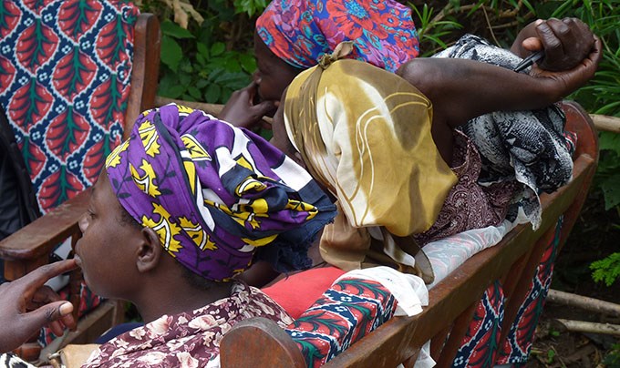 Three women dressed in colorful clothes.