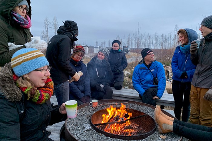 Researchers around the fire.