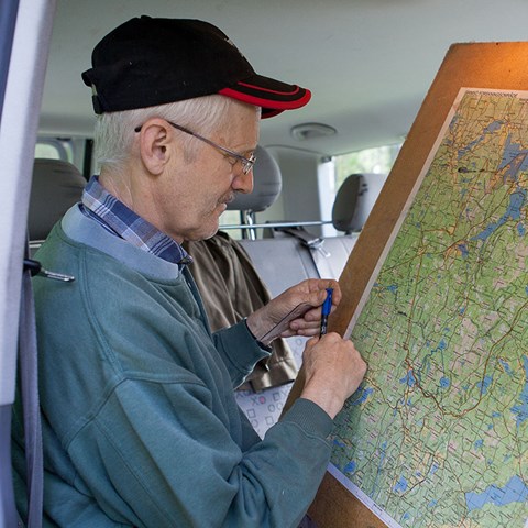 Man studies a map.
