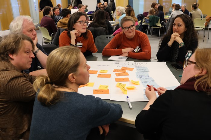 People discussing soil health during a workshop.