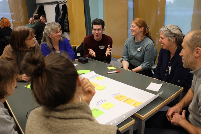 People discussing soil health during a workshop.