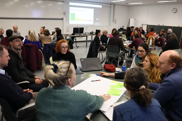 People discussing soil health during a workshop. 