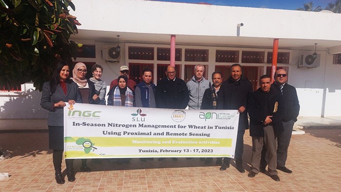 group photo of researchers holding a banner with the project name