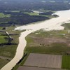 Flooded land along river. 