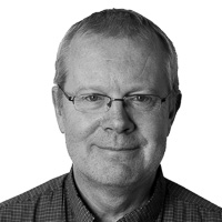 Portrait photo of a man with glasses. 