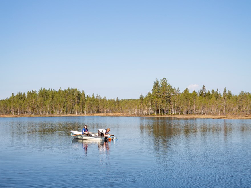 Sampling lake water in Krycklan