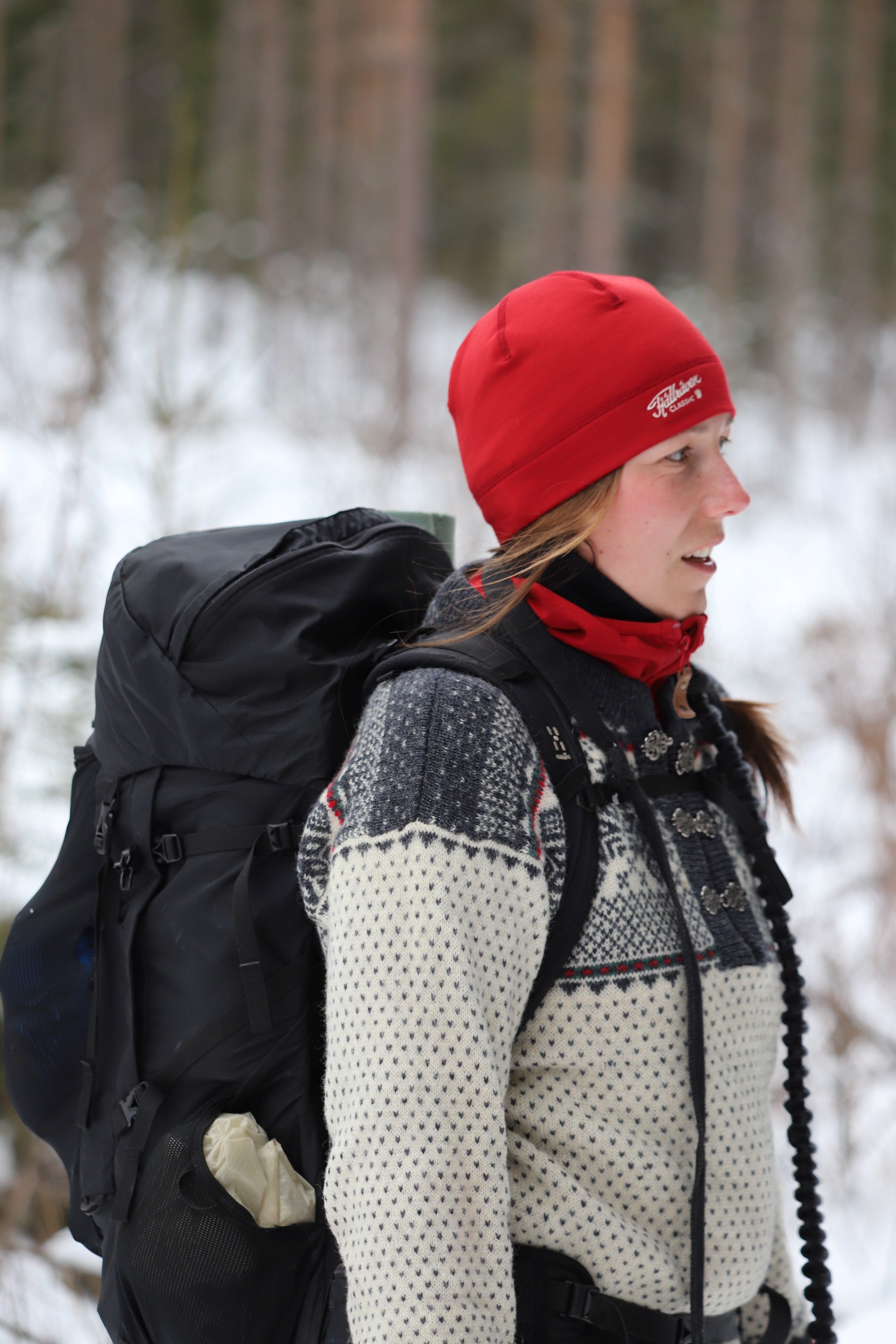 Ulrika Fellman with backpack red hat and knitted sweater