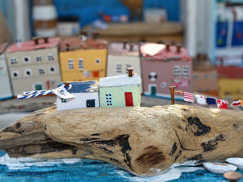 Model of coast village made from cartonnage and wood. Photo.