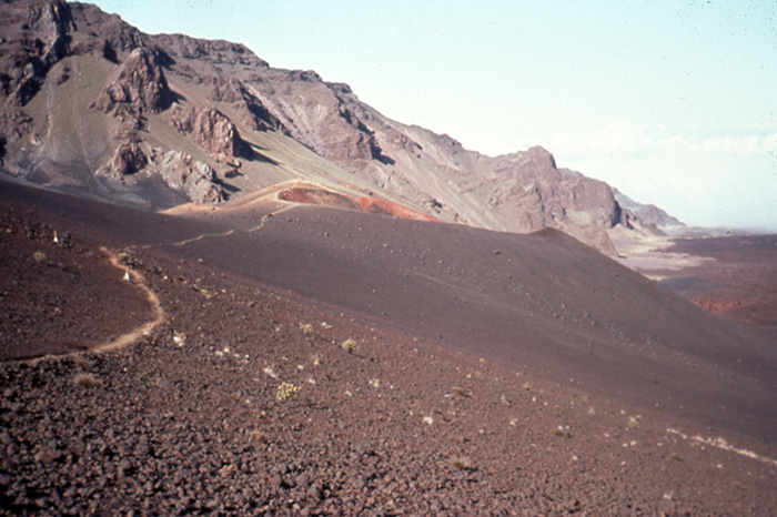A mountain with stony ground in front of it, photo.