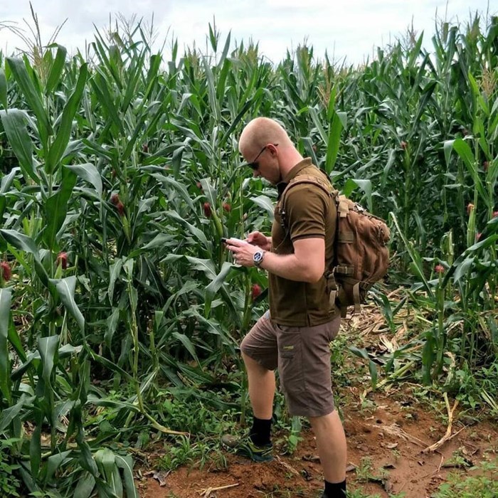 Adam Turner in a corn field. Photo.