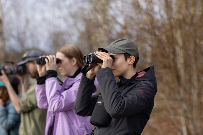 Students with binoculars. Photo.