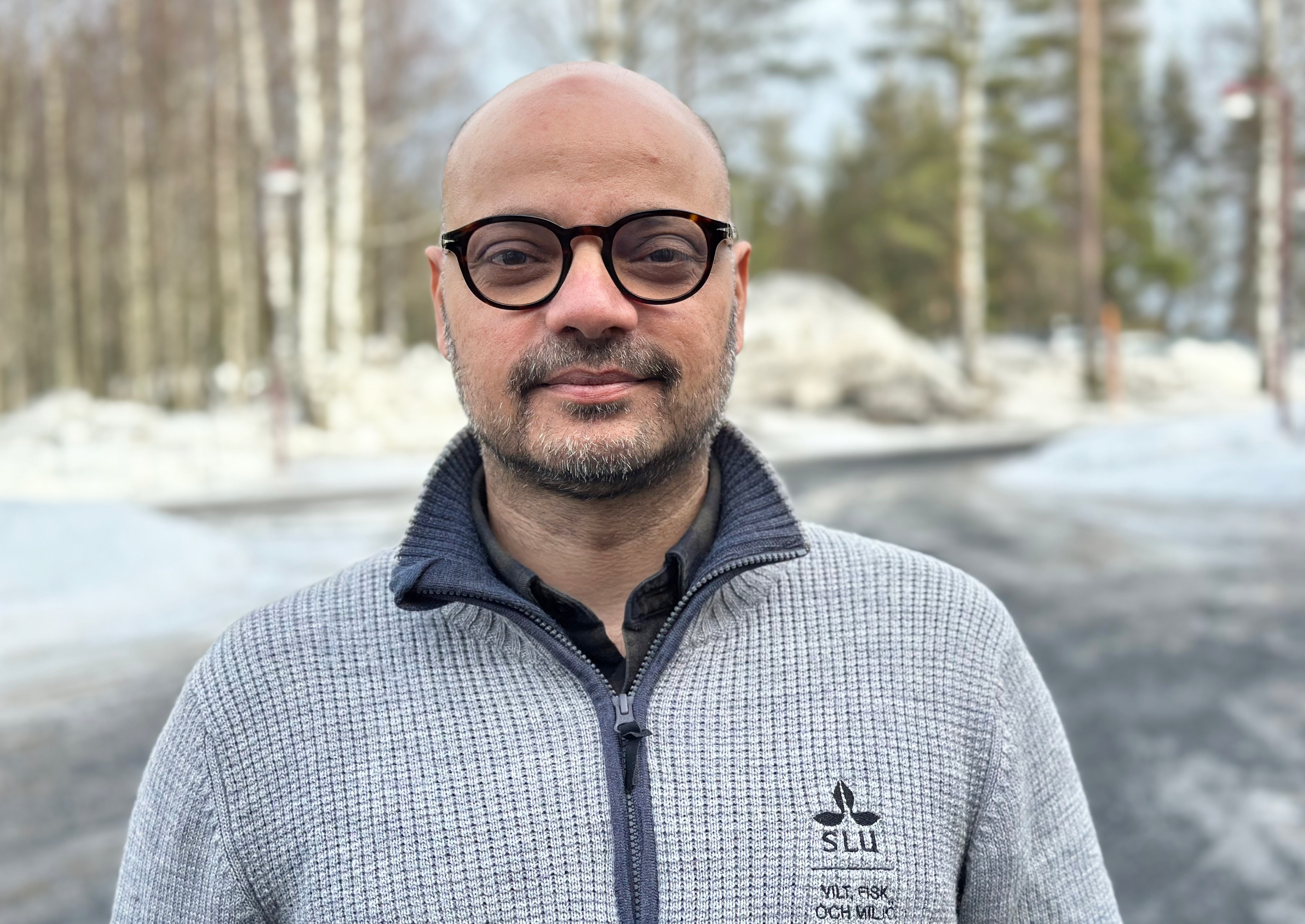 man in grey sweater