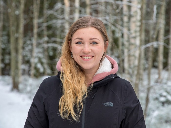 Portrait of Michelle in a forest during winter