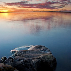 Lake with rock in the foreground, photo.