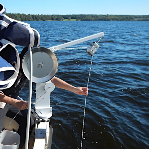 Sampling from a boat with a winch. Photo.
