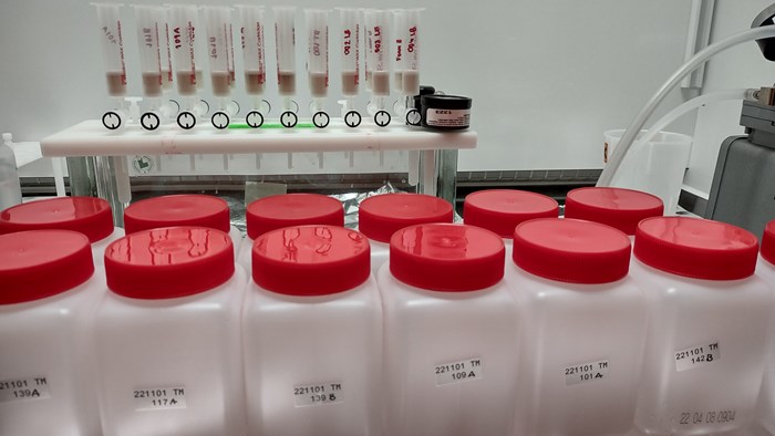 Sample bottles in fume hood. Photo.