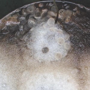 Bubbles on the surface of water in a barrel, photo.