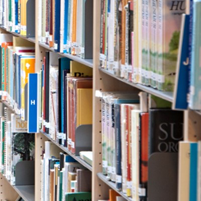 Books in a library. Photo.