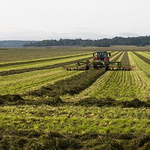 A tractor drives in a field.