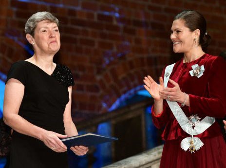 Two women in elegant dresses.