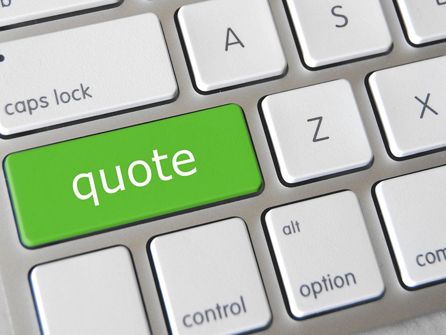 The word quote on a computer keyboard, close up. 
